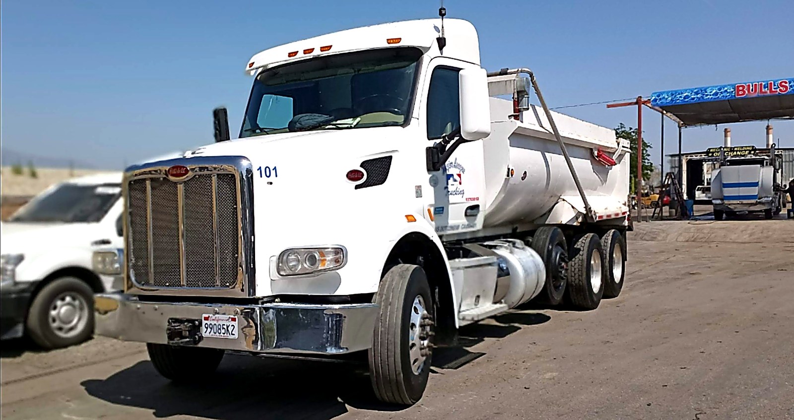 White dump truck yard photo