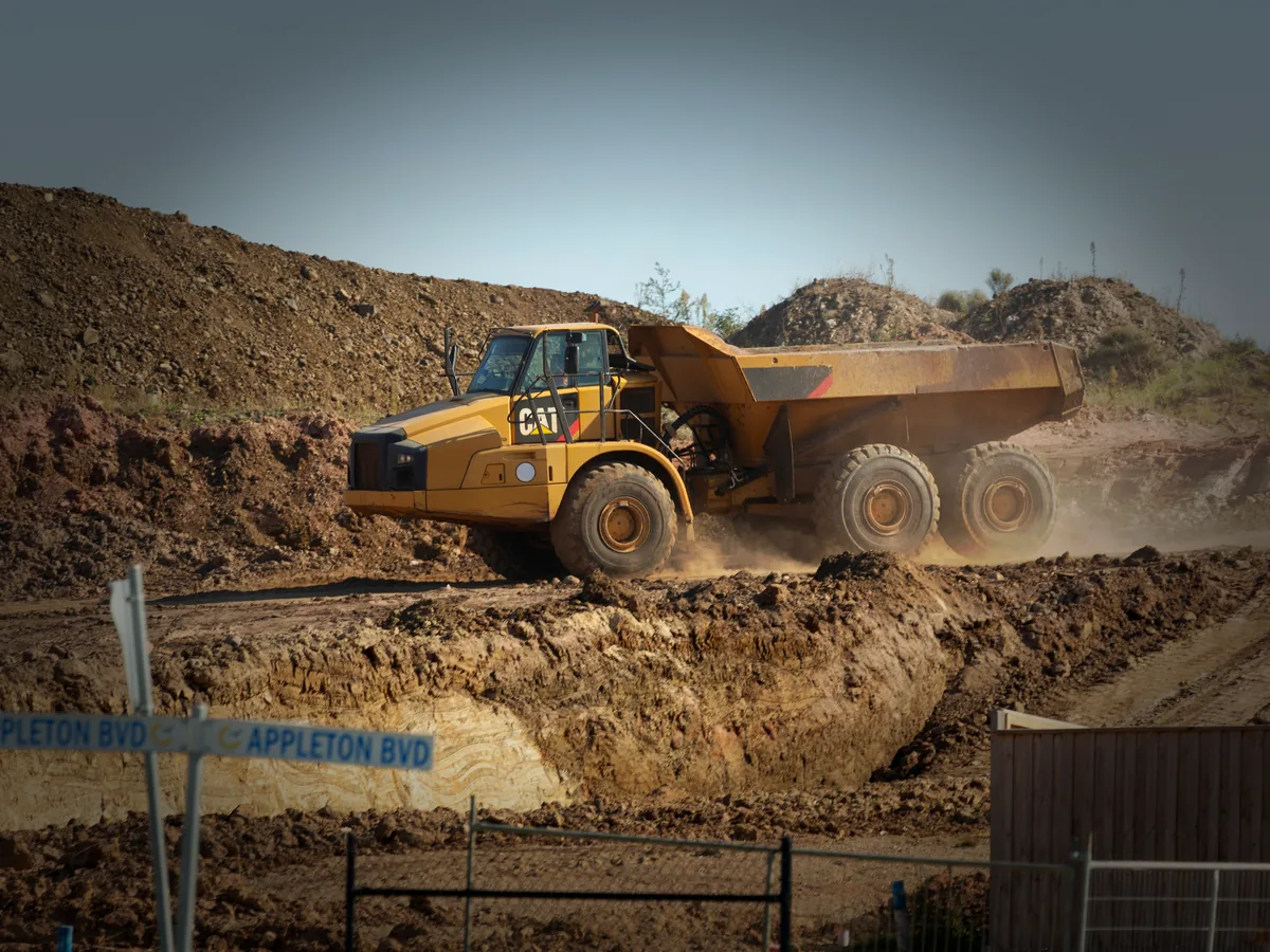 Super 10 style dump truck at jobsite